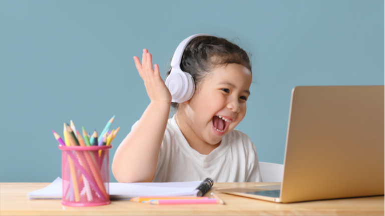 happy-little-asian-girl-studying-online-learning-class-with-online-video-call-zoom-teacher-home